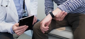 Wearable tech and doctor with tablet